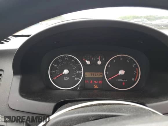 2005 Hyundai Tiburon GS z VIN KMHHM65D35U182780, wystawiony jako Copart lot #58958295 z przebiegiem 186 652 mil mil oraz Czysty tytuł • Clean title. Historia ofert i sprzedaży dostępna na DreamBid. Obrazek 9.