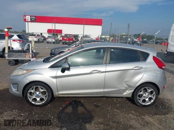 2011 Ford Fiesta SES with VIN 3FADP4FJ4BM239822, listed as a IAAI auction lot 42893176 with 159,918 mi miles and . Bid and sale history available at DreamBid. Image 14.