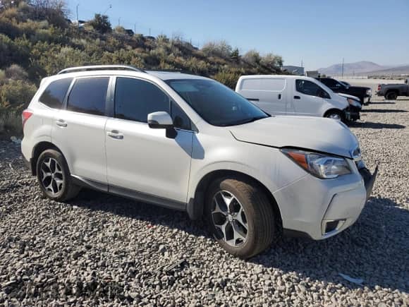 2014 Subaru Forester XT Touring with VIN JF2SJGMC0EH421231, listed as a Copart auction lot 65372135 with 117,057 mi miles and Salvage title. Bid and sale history available at DreamBid. Image 4.
