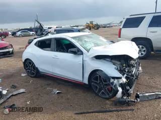 2021 Hyundai Veloster z VIN KMHT36AH8MU010295, wystawiony jako IAAI lot #40870747 z przebiegiem 38 885 mil mil oraz . Historia ofert i sprzedaży dostępna na DreamBid. Obrazek 1.