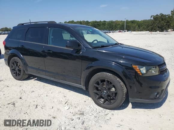 2019 Dodge Journey SE with VIN 3C4PDCBG0KT802777, listed as a Copart auction lot 80991945 with 174,659 mi miles and Salvage title. Bid and sale history available at DreamBid. Image 4.