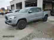 2021 Toyota Tacoma TRD Off Road with VIN 3TMCZ5AN5MM429356, listed as a Copart auction lot 71444135 with 68,728 mi miles and Salvage title. Bid and sale history available at DreamBid. Image 1.