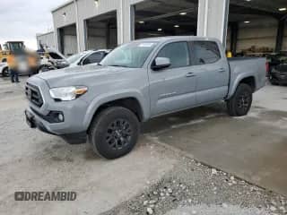 2021 Toyota Tacoma TRD Off Road with VIN 3TMCZ5AN5MM429356, listed as a Copart auction lot 71444135 with 68,728 mi miles and Salvage title. Bid and sale history available at DreamBid. Image 1.