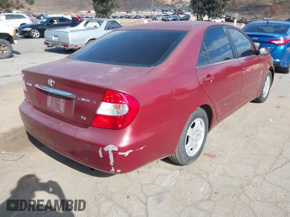 2002 Toyota Camry XLE with VIN 4T1BF32K12U020966, listed as a IAAI auction lot 43502658 with 200,609 mi miles and . Bid and sale history available at DreamBid. Image 4.