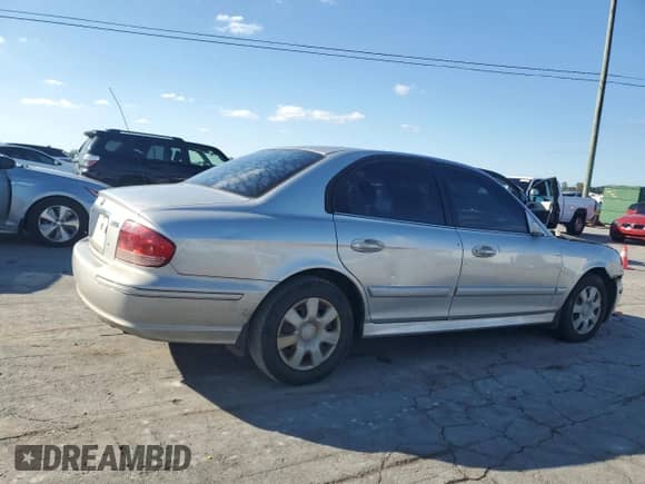 2003 Hyundai Sonata with VIN KMHWF25HX3A868844, listed as a Copart auction lot 81922105 with 513,136 mi miles and Salvage title. Bid and sale history available at DreamBid. Image 3.