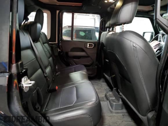 2023 Jeep Wrangler Sahara Altitude with VIN 1C4HJXEG9PW595565, listed as a Copart auction lot 77230394 with 28,477 mi miles and Salvage title. Bid and sale history available at DreamBid. Image 11.