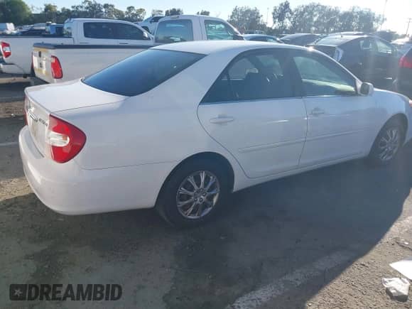 2003 Toyota Camry LE with VIN JTDBE32K730188966, listed as a IAAI auction lot 43482477 with 205,481 mi miles and . Bid and sale history available at DreamBid. Image 4.