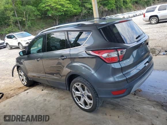 2017 Ford Escape Titanium с VIN 1FMCU0J91HUD04386, выставлен на аукционе Copart как лот 55525535 с пробегом 127 440 миль миль и Списание • Salvage title. История ставок и продаж доступна на DreamBid. Изображение 2.
