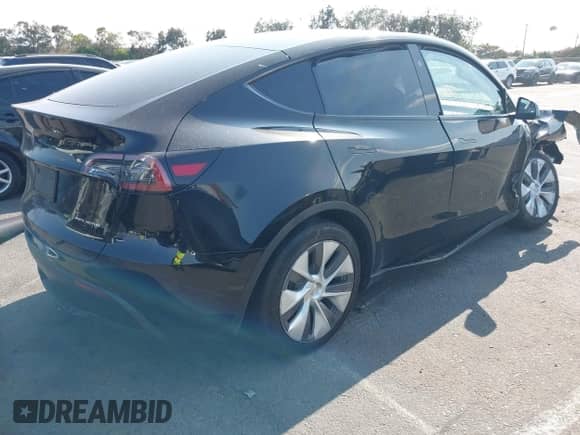 2023 Tesla Model Y Long Range z VIN 7SAYGAEE9PF851348, wystawiony jako IAAI lot #43167064 z przebiegiem Nie podano mil oraz . Historia ofert i sprzedaży dostępna na DreamBid. Obrazek 4.