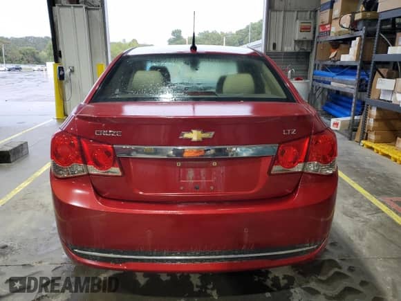 2012 Chevrolet Cruze LTZ z VIN 1G1PH5SC3C7194037, wystawiony jako Copart lot #85600105 z przebiegiem 136 584 mil mil oraz Szkoda całkowita • Salvage title. Historia ofert i sprzedaży dostępna na DreamBid. Obrazek 6.