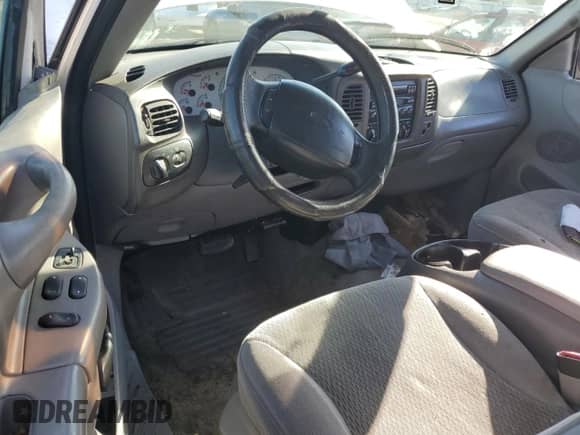 1997 Ford F-150 XL z VIN 1FTEX17L9VKB65855, wystawiony jako Copart lot #87410414 z przebiegiem 198 005 mil mil oraz Szkoda całkowita • Salvage title. Historia ofert i sprzedaży dostępna na DreamBid. Obrazek 8.