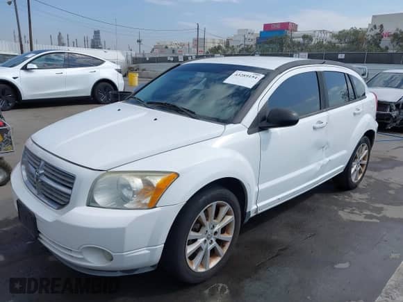 2011 Dodge Caliber Heat with VIN 1B3CB5HA8BD205483, listed as a IAAI auction lot 43289154 with 184,797 mi miles and . Bid and sale history available at DreamBid. Image 2.