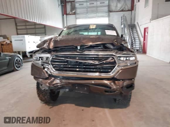 2020 Ram 1500 Longhorn with VIN 1C6SRFKT1LN275397, listed as a IAAI auction lot 42733634 with 101,019 mi miles and . Bid and sale history available at DreamBid. Image 12.