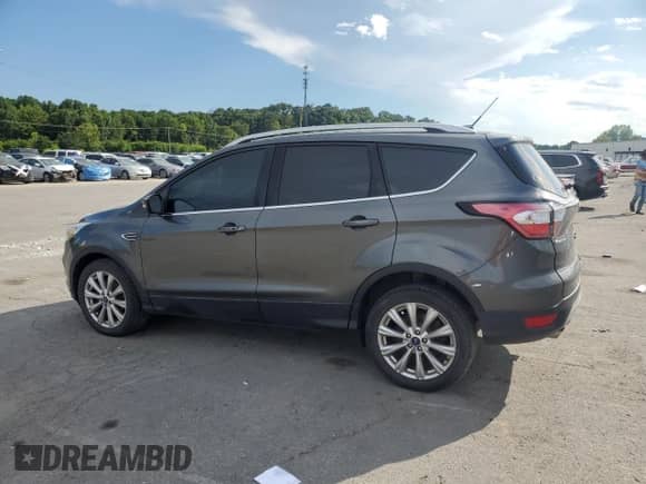 2017 Ford Escape Titanium с VIN 1FMCU0JD6HUD17364, выставлен на аукционе Copart как лот 68642355 с пробегом 87 671 миль миль и Списание • Salvage title. История ставок и продаж доступна на DreamBid. Изображение 2.