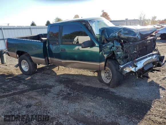 1997 GMC Sierra 1500 with VIN 2GTEK19R2V1524267, listed as a Copart auction lot 89885715 with 331,664 mi miles and Salvage title. Bid and sale history available at DreamBid. Image 4.