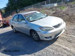 2005 Toyota Camry XLE with VIN 4T1BF30K25U604039, listed as a IAAI auction lot 43139598 with 271,651 mi miles and . Bid and sale history available at DreamBid. Image 1.