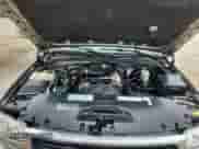 2000 GMC Sierra 1500 z VIN 1GTEK14W0YZ189857, wystawiony jako Copart lot #65653585 z przebiegiem 191 262 mil mil oraz Nie do naprawy • Non repairable. Historia ofert i sprzedaży dostępna na DreamBid. Obrazek 11.