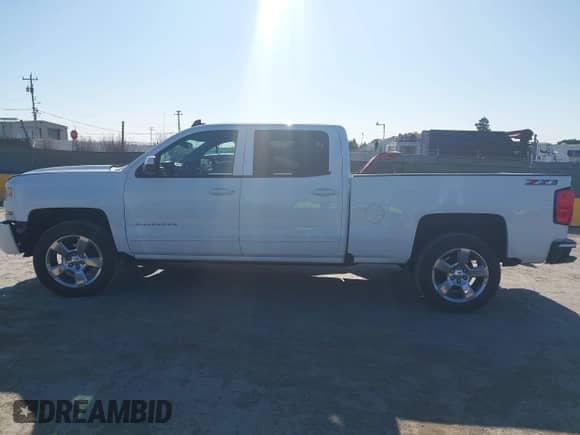 2018 Chevrolet Silverado 1500 LT with VIN 1GCUKRECXJF180945, listed as a IAAI auction lot 42450588 with 108,199 mi miles and . Bid and sale history available at DreamBid. Image 14.