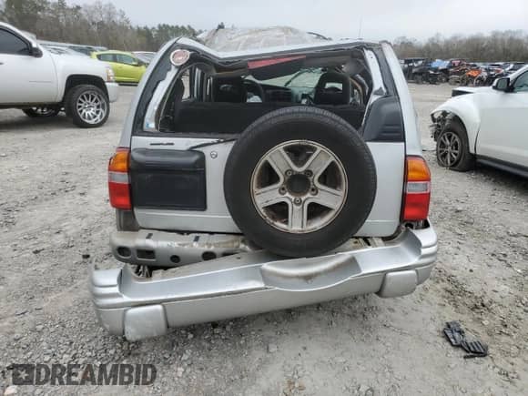 2004 Chevrolet Tracker LT with VIN 2CNBE634446902199, listed as a Copart auction lot 89174685 with Not provided miles and Salvage title. Bid and sale history available at DreamBid. Image 6.