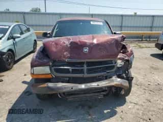 2002 Dodge Dakota z VIN 1B7FL16X52S723460, wystawiony jako Copart lot #68029915 z przebiegiem Nie podano mil oraz Szkoda całkowita • Salvage title. Historia ofert i sprzedaży dostępna na DreamBid. Obrazek 5.