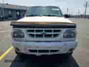 1999 Ford Explorer XLT with VIN 1FMZU34E1XZA28197, listed as a Copart auction lot 58852855 with 115,367 mi miles and Salvage title. Bid and sale history available at DreamBid. Image 5.