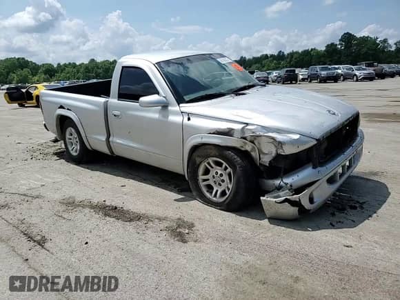 2002 Dodge Dakota z VIN 1B7FL16X12S692630, wystawiony jako Copart lot #66768875 z przebiegiem 135 930 mil mil oraz Szkoda całkowita • Salvage title. Historia ofert i sprzedaży dostępna na DreamBid. Obrazek 13.