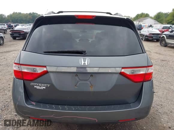 2012 Honda Odyssey EX z VIN 5FNRL5H40CB083650, wystawiony jako IAAI lot #43283741 z przebiegiem 164 693 mil mil oraz . Historia ofert i sprzedaży dostępna na DreamBid. Obrazek 16.