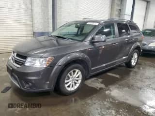 2017 Dodge Journey SXT with VIN 3C4PDDBG1HT561018, listed as a Copart auction lot 69006095 with 136,612 mi miles and Salvage title. Bid and sale history available at DreamBid. Image 1.