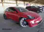 2022 Tesla Model Y Performance with VIN 7SAYGDEF0NF326718, listed as a Copart auction lot 80870095 with 59,035 mi miles and Salvage title. Bid and sale history available at DreamBid. Image 4.