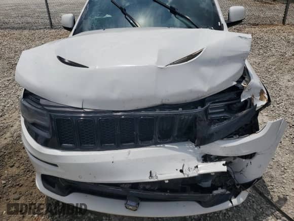 2014 Jeep Grand Cherokee SRT-8 z VIN 1C4RJFDJ2EC242210, wystawiony jako Copart lot #60677855 z przebiegiem 68 050 mil mil oraz Szkoda całkowita • Salvage title. Historia ofert i sprzedaży dostępna na DreamBid. Obrazek 12.