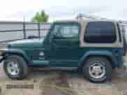 1999 Jeep Wrangler Sahara z VIN 1J4FY49S5XP482037, wystawiony jako IAAI lot #42341723 z przebiegiem 161 081 mil mil oraz . Historia ofert i sprzedaży dostępna na DreamBid. Obrazek 15.