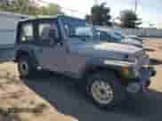 2000 Jeep Wrangler SE with VIN 1J4FA29P4YP775935, listed as a Copart auction lot 80458955 with 100,211 mi miles and Salvage title. Bid and sale history available at DreamBid. Image 4.