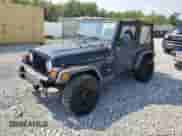 2000 Jeep Wrangler Sport with VIN 1J4FA49S5YP744967, listed as a Copart auction lot 67909665 with 141,990 mi miles and Clean title. Bid and sale history available at DreamBid. Image 1.