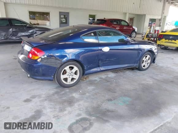 2003 Hyundai Tiburon с VIN KMHHM65D83U061336, выставлен на аукционе IAAI как лот 43151967 с пробегом 235 589 миль миль и . История ставок и продаж доступна на DreamBid. Изображение 4.