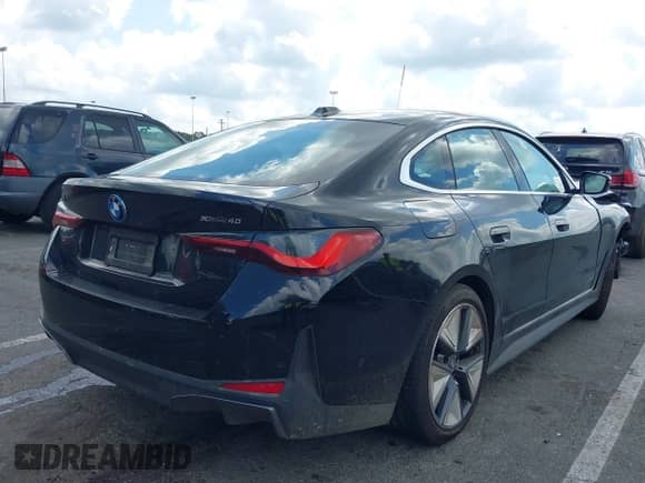 2024 BMW i4 xDrive40 with VIN WBY83FB03RFT31075, listed as a IAAI auction lot 42743691 with 14,883 mi miles and . Bid and sale history available at DreamBid. Image 4.