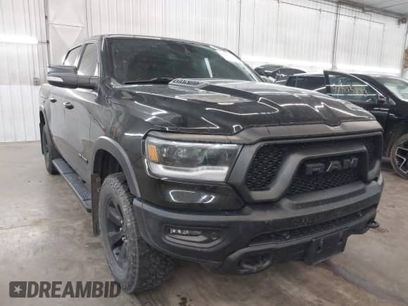 2020 Ram 1500 Rebel z VIN 1C6SRFLT7LN187484, wystawiony jako IAAI lot #42496264 z przebiegiem 80 426 mil mil oraz . Historia ofert i sprzedaży dostępna na DreamBid. Obrazek 1.