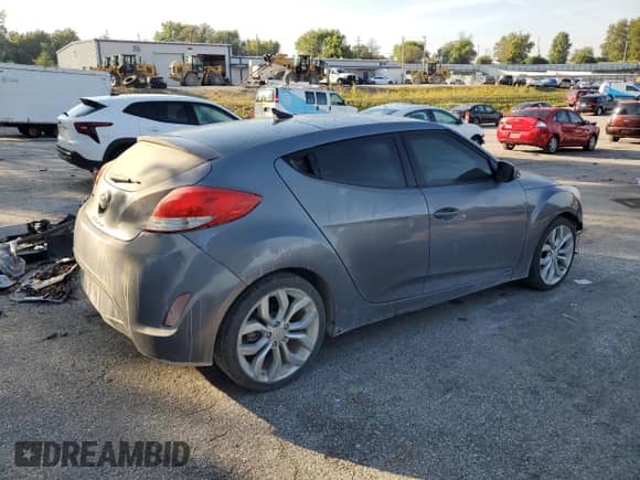 2013 Hyundai Veloster w/Black Int z VIN KMHTC6AD1DU130100, wystawiony jako Copart lot #83947425 z przebiegiem 155 402 mil mil oraz Szkoda całkowita • Salvage title. Historia ofert i sprzedaży dostępna na DreamBid. Obrazek 3.