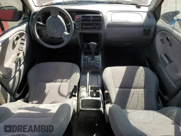 2001 Chevrolet Tracker with VIN 2CNBE13C816917150, listed as a Copart auction lot 77093144 with Not provided miles and Salvage title. Bid and sale history available at DreamBid. Image 8.