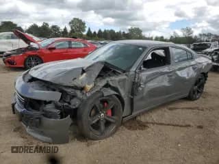 2017 Dodge Charger SE with VIN 2C3CDXBG3HH579131, listed as a Copart auction lot 71523305 with 57,928 mi miles and Salvage title. Bid and sale history available at DreamBid. Image 1.