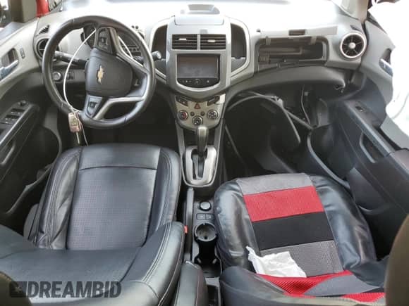 2014 Chevrolet Sonic LTZ с VIN 1G1JE5SB5E4232734, выставлен на аукционе Copart как лот 61574285 с пробегом Не указан миль и Списание • Salvage title. История ставок и продаж доступна на DreamBid. Изображение 8.