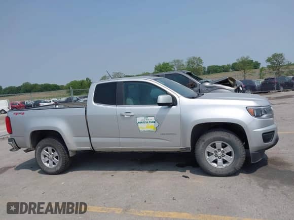 2018 Chevrolet Colorado 4WD Work Truck z VIN 1GCHTBEN4J1234714, wystawiony jako IAAI lot #42399979 z przebiegiem 166 408 mil mil oraz . Historia ofert i sprzedaży dostępna na DreamBid. Obrazek 13.
