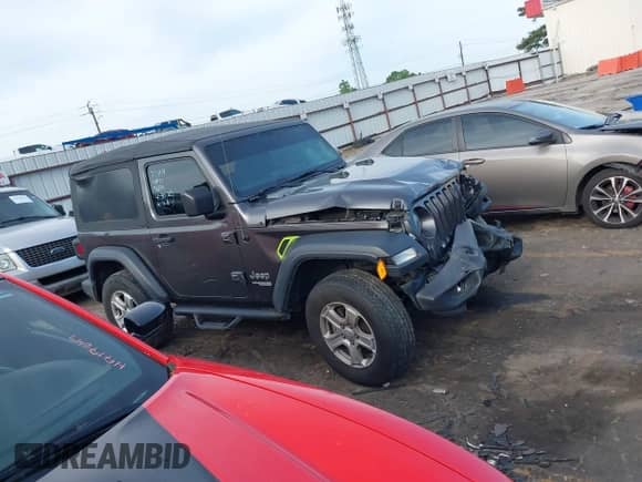 2020 Jeep Wrangler Sport S with VIN 1C4GJXAG9LW303604, listed as a IAAI auction lot 42221305 with 71,189 mi miles and . Bid and sale history available at DreamBid. Image 13.