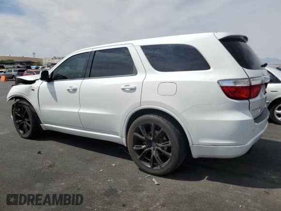 2013 Dodge Durango R/T with VIN 1C4SDHCT0DC556878, listed as a Copart auction lot 70955065 with 187,119 mi miles and Salvage title. Bid and sale history available at DreamBid. Image 2.