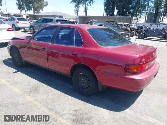 1995 Toyota Camry LE z VIN JT2SK12E6S0298227, wystawiony jako IAAI lot #42788533 z przebiegiem 112 709 mil mil oraz . Historia ofert i sprzedaży dostępna na DreamBid. Obrazek 3.