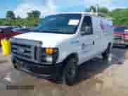 2013 Ford Econoline Cargo Commercial with VIN 1FTNE1EW6DDA74029, listed as a IAAI auction lot 42951238 with 120,720 mi miles and . Bid and sale history available at DreamBid. Image 2.