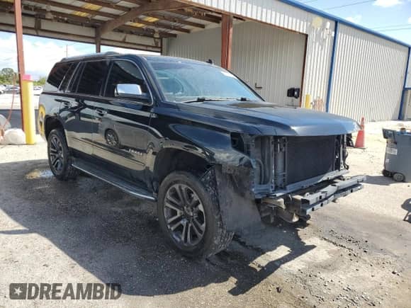 2015 Chevrolet Tahoe LTZ with VIN 1GNSKCKC3FR216657, listed as a Copart auction lot 85706835 with 195,674 mi miles and Salvage title. Bid and sale history available at DreamBid. Image 4.