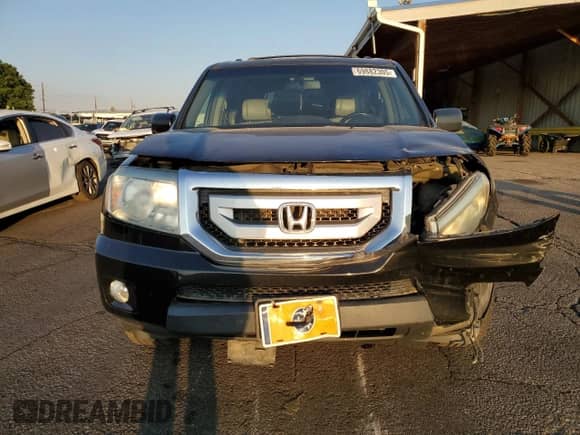 2010 Honda Pilot Touring with VIN 5FNYF4H87AB038749, listed as a Copart auction lot 69882305 with 141,496 mi miles and Salvage title. Bid and sale history available at DreamBid. Image 5.