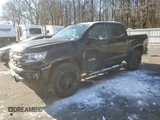 2021 Chevrolet Colorado 4WD Z71 with VIN 1GCGTDENXM1240416, listed as a Copart auction lot 87875155 with 100,981 mi miles and Salvage title. Bid and sale history available at DreamBid. Image 1.