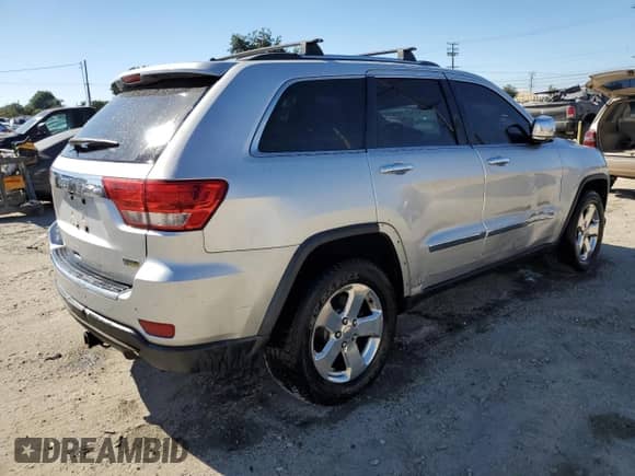 2012 Jeep Grand Cherokee Limited z VIN 1C4RJEBG2CC317633, wystawiony jako Copart lot #81336605 z przebiegiem 166 863 mil mil oraz Szkoda całkowita • Salvage title. Historia ofert i sprzedaży dostępna na DreamBid. Obrazek 3.