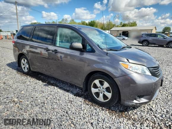 2012 Toyota Sienna with VIN 5TDZK3DCXCS233781, listed as a Copart auction lot 82167325 with 183,332 mi miles and Salvage title. Bid and sale history available at DreamBid. Image 4.